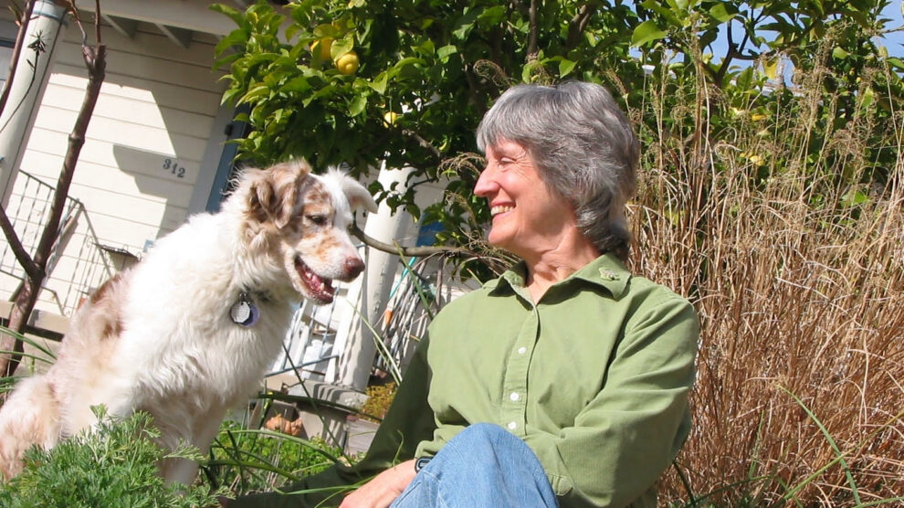 Donna Haraway outside with dog