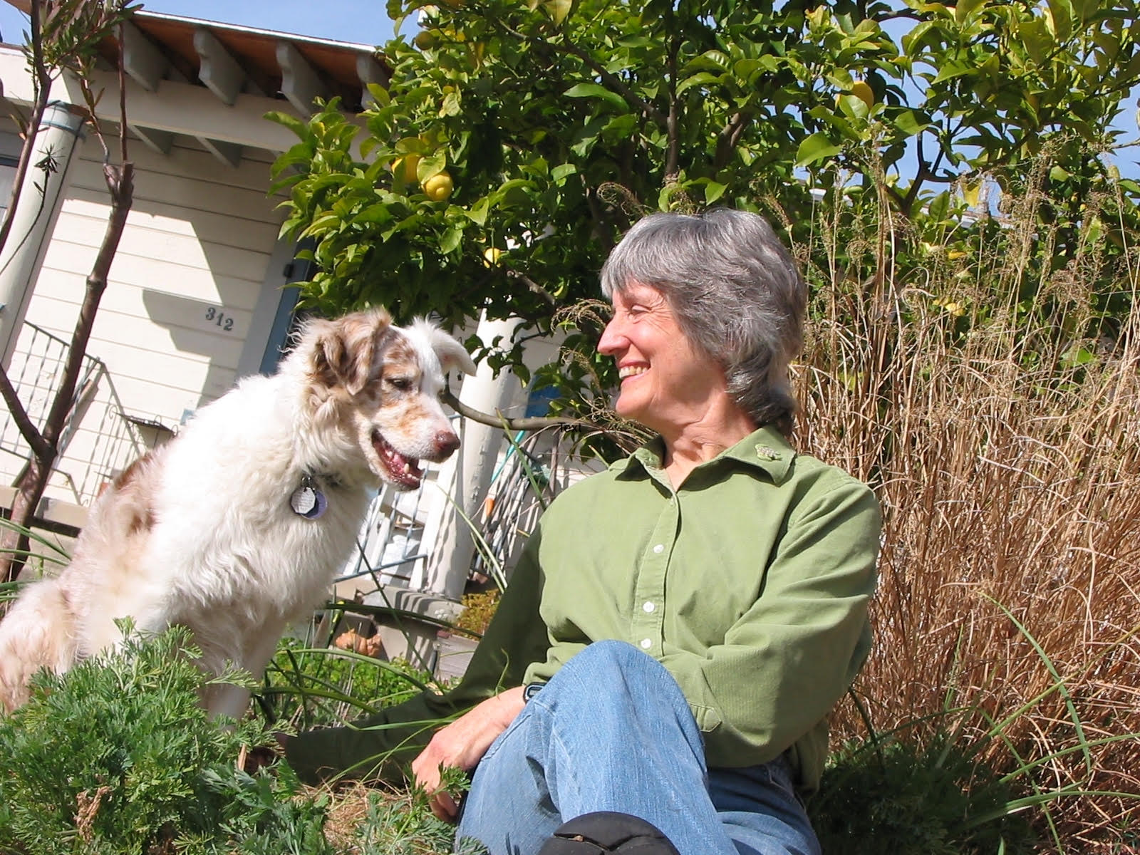 Donna Haraway outside with dog