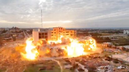 Al-Azhar University main building during destruction (Source: WAFA Palestine News & Info Agency)